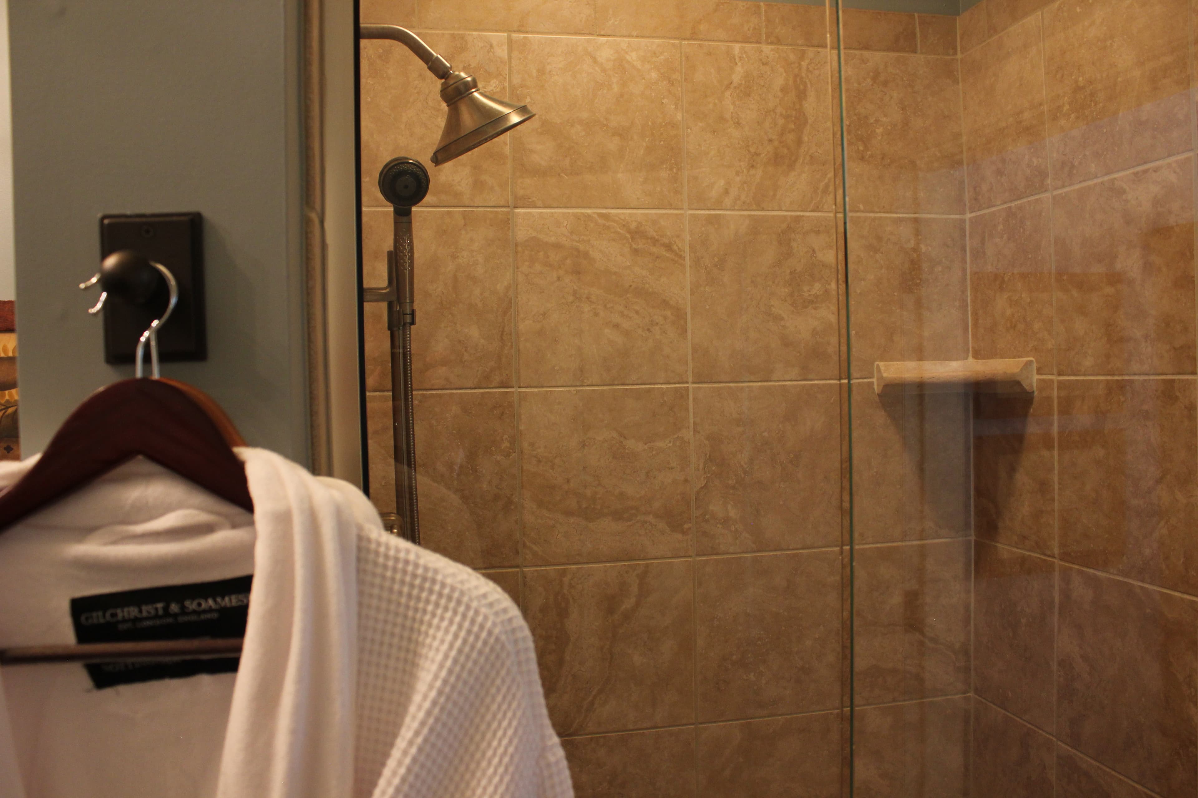 Walk-in shower with multiple shower heads