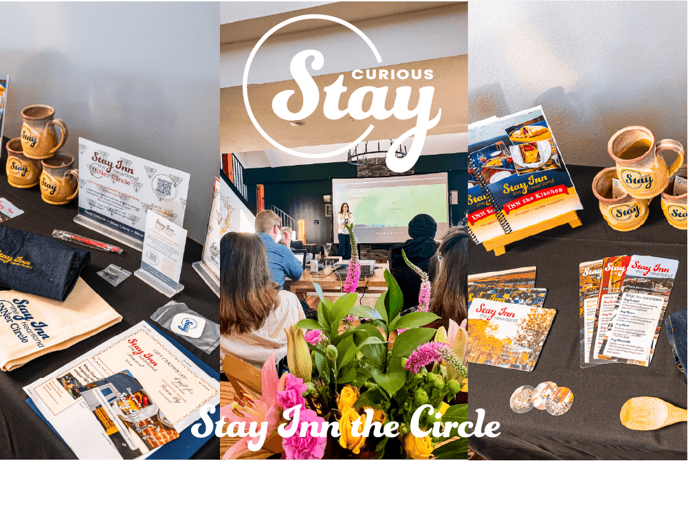 Promotional materials and attendees at a Stay Inn presentation, featuring mugs, brochures, and a speaker.