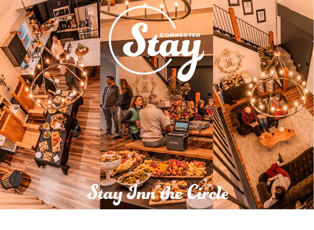 A cozy gathering space with food and people socializing in a warm, inviting inn.