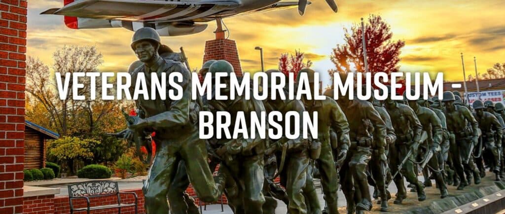 A statue of soldiers in formation at the Veterans Memorial Museum in Branson, with a plane overhead.