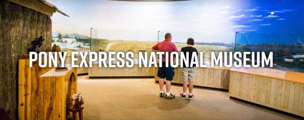Two visitors observe exhibits at the Pony Express National Museum.