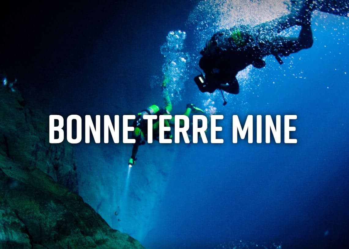 Two divers exploring the underwater scenery of Bonne Terre Mine. Two divers exploring the underwater scenery of Bonne Terre Mine.