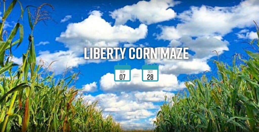 A vibrant blue sky above a corn maze with the text "Liberty Corn Maze" and dates September 7 to October 28.